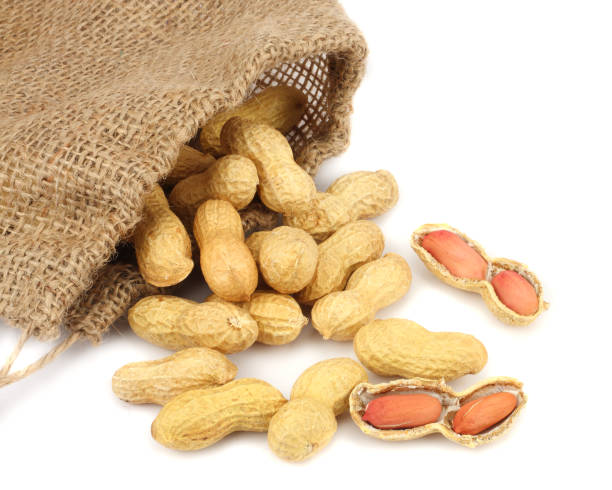 istock peanuts with sack cloth isolated on the white background 887654134