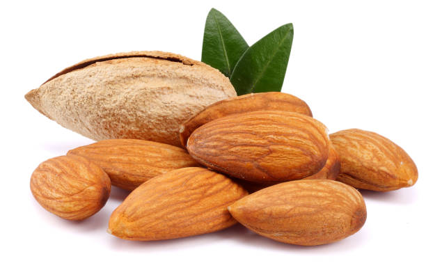 istock almond with green leaf isolated on white background 887654370