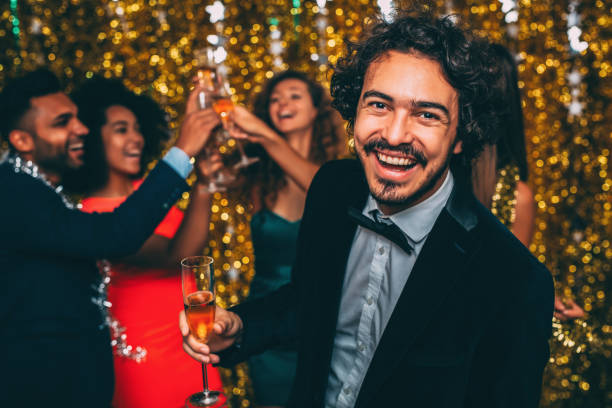 istock Man at a New Year's Eve party 887654710