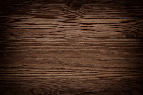 istock Dark brown scratched wooden cutting board. Wood texture 887655164