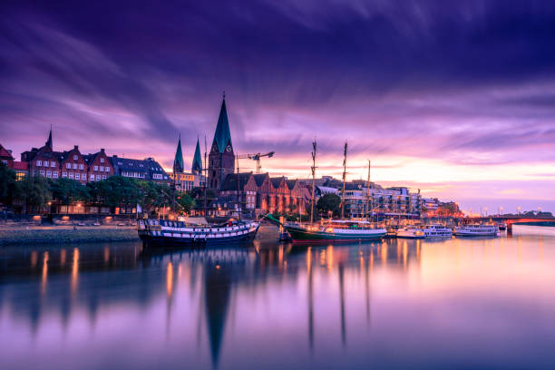 Morning Skyline of Bremen Old Town Morning Skyline of Bremen Old Town as seen over Weser river. Long exposure, artistic filters applied prague skyline panoramic scenics stock pictures, royalty-free photos & images