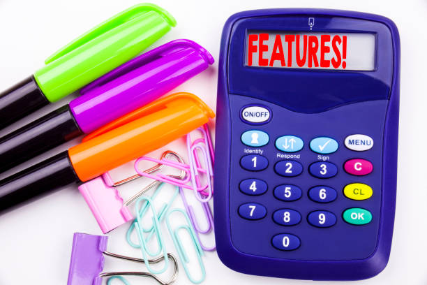 istock Writing word Features text in the office with surroundings such as marker, pen writing on calculator. Business concept for Advertisement Advertising white background with copy space 887664726