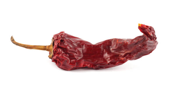 istock Dried red chili or chilli cayenne pepper isolated on white background cutout 887665146