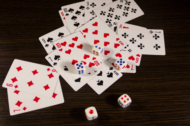 istock Playing cards and dice on a table. Game concept 887669762