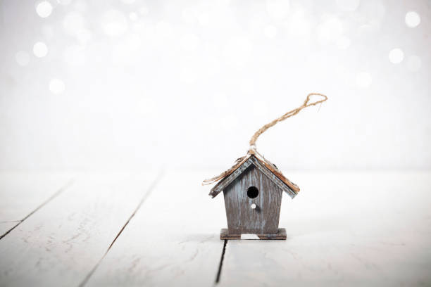 istock birdhouse on rustic wooden background 887670300