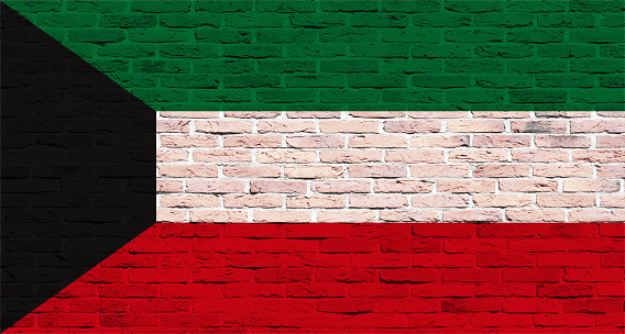 Kuwaiti flag painted over brick wall