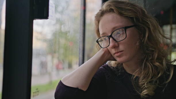 istock Young Blond Lady on the Bus 887690608