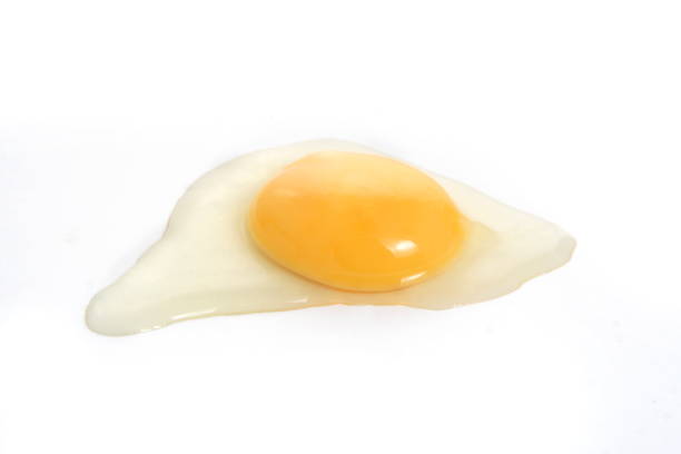 istock Photo of Spill Raw Chicken Egg, at White Background 887704032