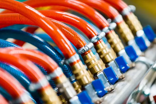 cooling system equipment in the factory, hoses and cocks. Complex equipment