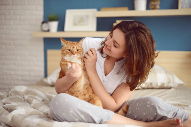 istock Young Women and cat 887704810