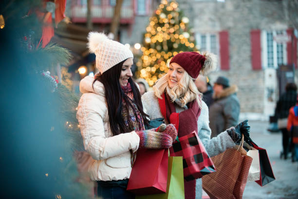 istock Christmas Shopping with two young women 887704814