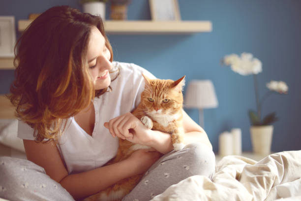 istock Young Women and cat 887704932