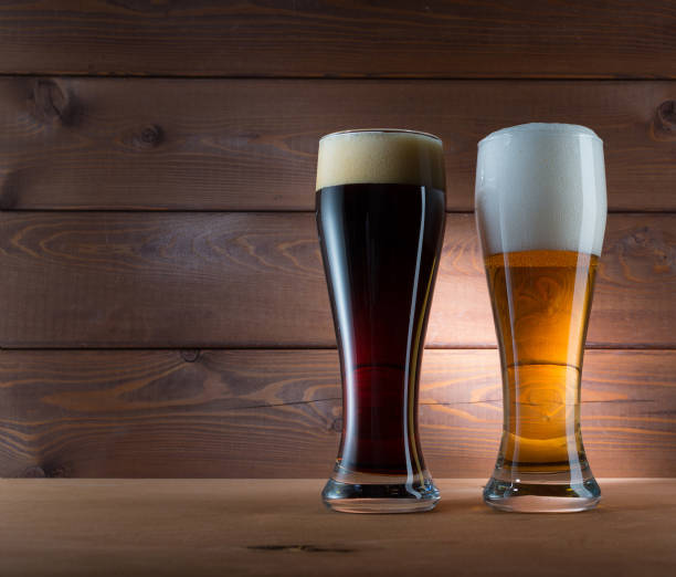 istock Two glasses of different colored beer 887706012
