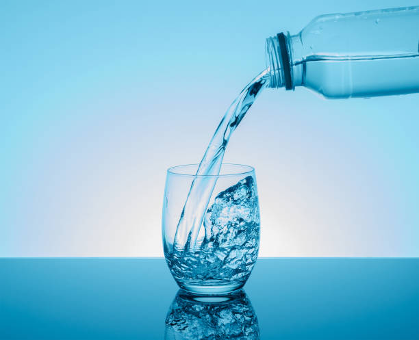 istock Creative splashing water in the glass 887708976