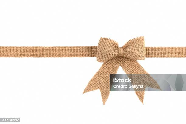 Burlap Ribbon Bow Isolated On White Background Stock Photo - Download Image Now - Tied Bow, Burlap, Cut Out