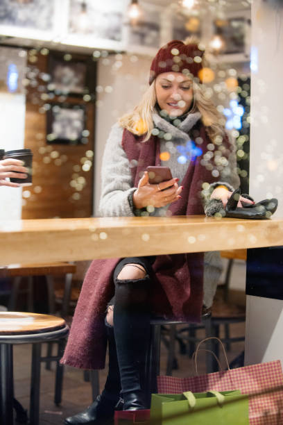 istock Christmas Shopping with two young women 887709780