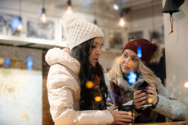 istock Christmas Shopping with two young women 887710216