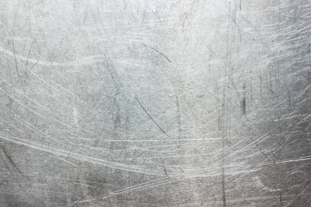 istock old steel wall ragged, scratched metal background 887715256
