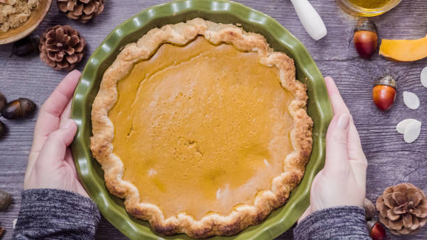 istock Baking home made pumpkin pie for Thanksgiving dinner. 887718046