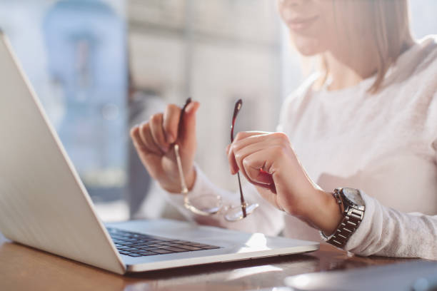 istock woman holding glasses 887731738