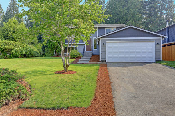 istock Lovely grey rambler house exterior features grey siding 887731746