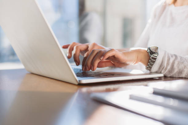 istock Woman typing on her laptop 887732038