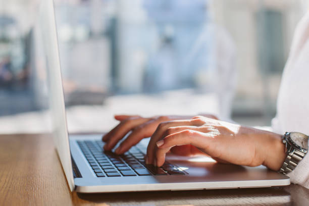 istock Woman typing on her laptop 887732188