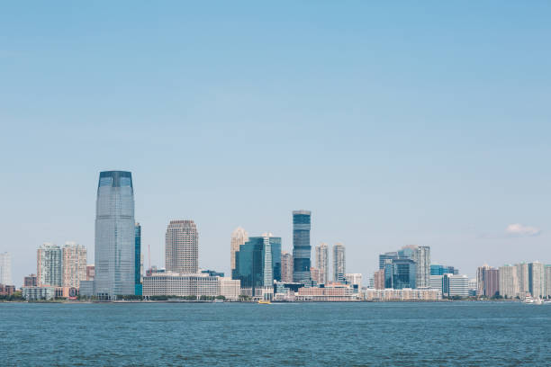 istock Sea By Cityscape Against Clear Sky 887732810