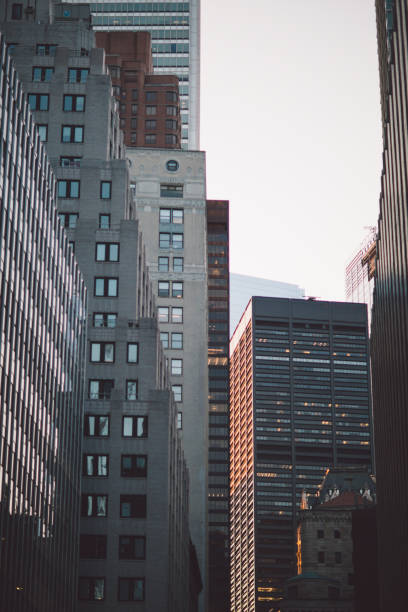 istock Skyscrapers In City Against Clear Sky 887744066
