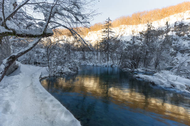 istock Plitvice lakes during winter with high level of snow 887744210