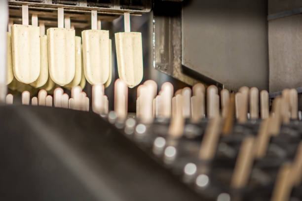 Process of moving the vanilla ice cream bars to get quality checked and wrapped in its package