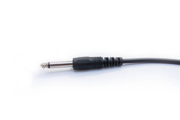 istock Guitar audio jack with black cable isolated on white background 887768164