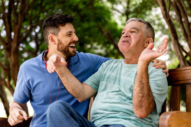 istock Dad and son having fun in the park 887773816