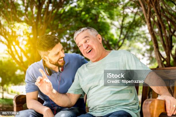 Dad And Son Having Fun In The Park Stock Photo - Download Image Now - Father, Son, Men