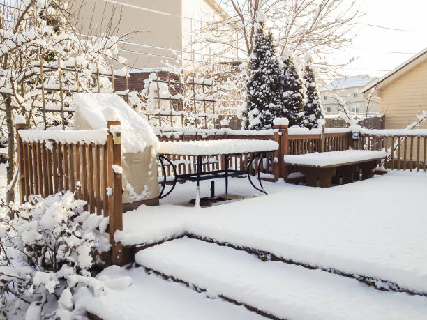 istock Garden patio after snowfall, winter scenery. 887777266
