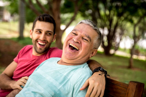Dad and son having fun in the park People collection father in law stock pictures, royalty-free photos & images