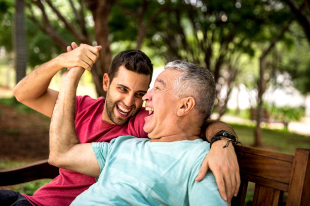 istock Dad and son having fun in the park 887778760