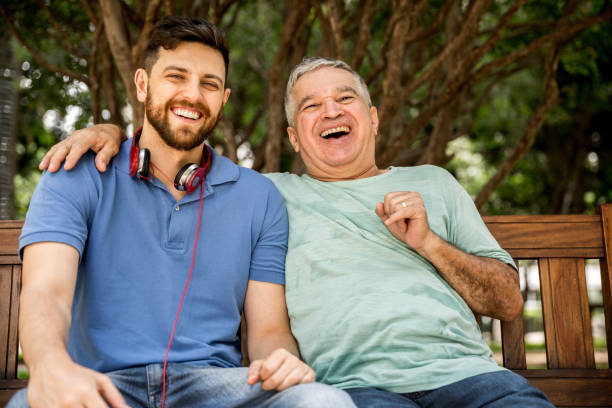 istock Dad and son having fun in the park 887779222