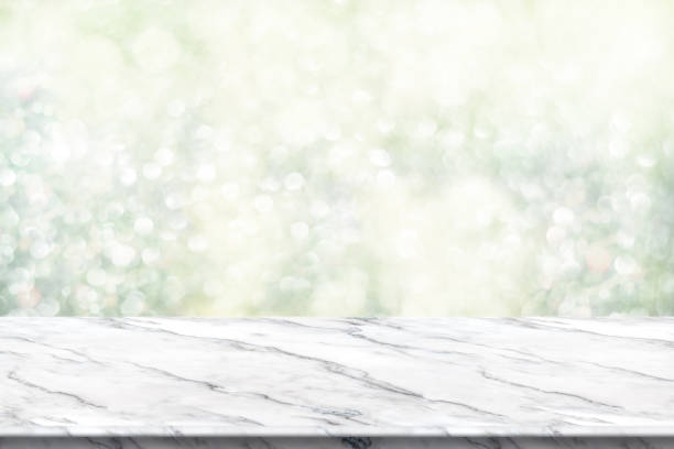 istock Empty white marble table top with abstract green blur christmas tree background with bokeh light,Holiday backdrop,Mock up banner for display or montage of product 887798596