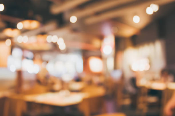 istock Restaurant cafe or coffee shop interior with people abstract blur background 887801398