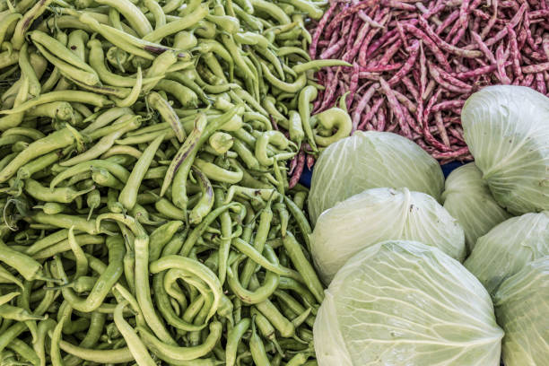 istock fresh banana peppers and cabbages as a background 887807174