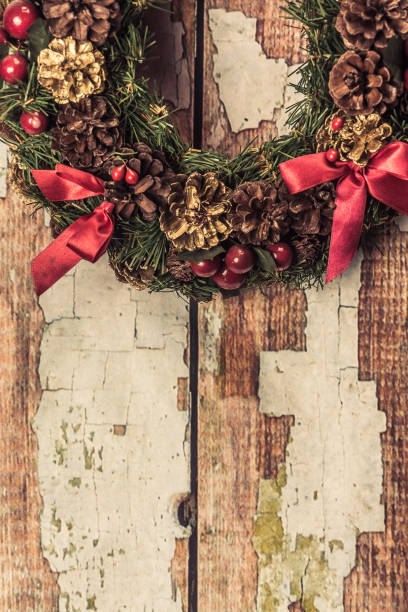 istock christmas wreath on wood background . 887814896