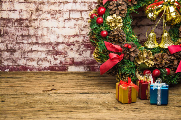 istock christmas wreath on  brick wall background . 887815078