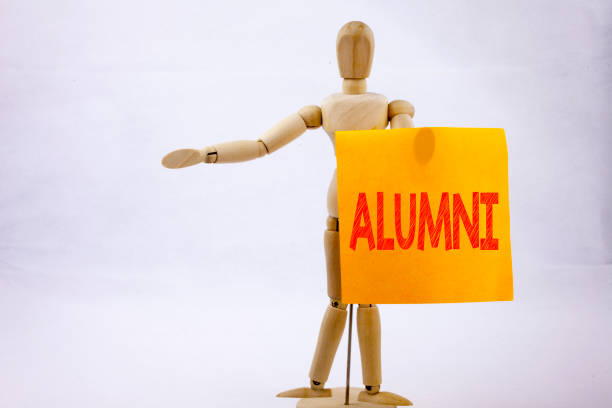 istock Conceptual hand writing text caption inspiration showing Alumni Former Students Business concept for Celebration Education Ending written on sticky note sculpture background with space 887819946