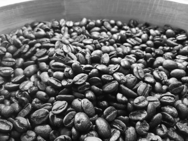 Roasted coffee beans used as a background.