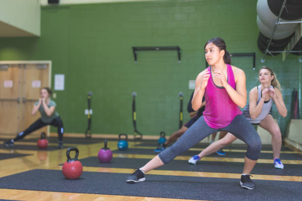 istock College students working out in fitness class together 887835814