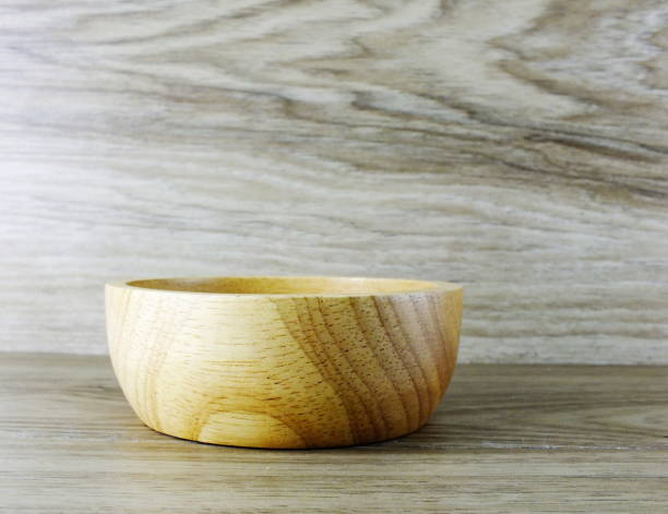 istock wooden bowl on wooden background 887836030