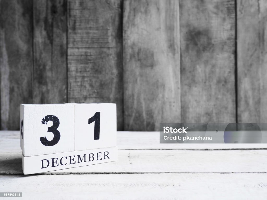 December 31st wooden block December 31st. White wooden block calendar show date 31 and month December on wood background with copy space. December Stock Photo