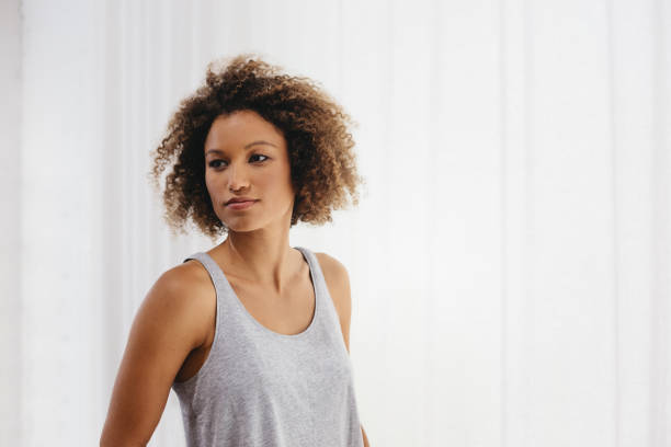 Beautiful mixed race woman looking off camera with a serious expression