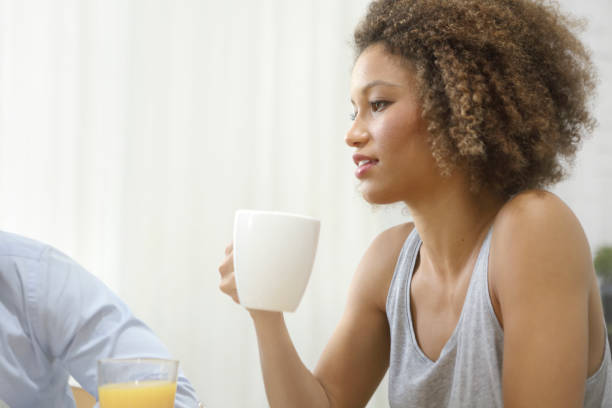 istock Young woman drinking coffee in the morning 887849782